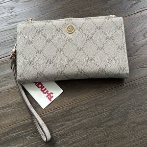 Ann Klein Wallet/wristlet,2 zippered coin areas,7 card slots.snap section